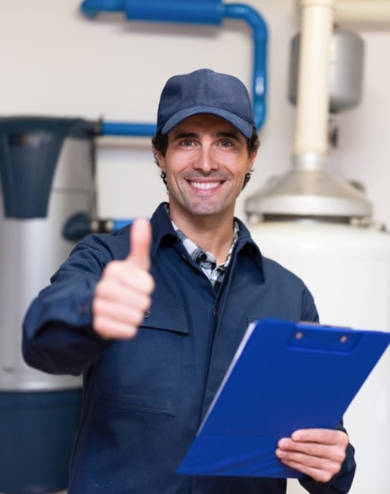 A mechanic showing thumbs up